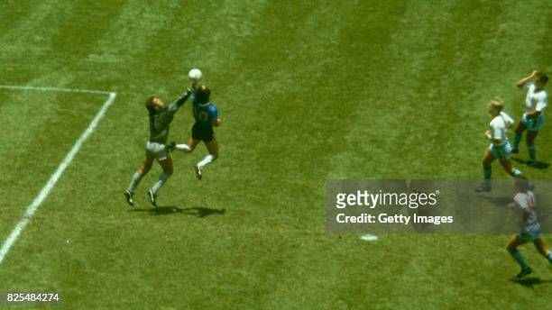 Argentina player Diego Maradona outjumps England goalkeeper Peter Shilton to score with his 'Hand of God' goal as England defenders Kenny Sansom Gary...