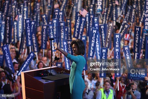 Michelle Obama, wife of presumptive Democratic nominee U.S. Sen. Barack Obama , waves to the crowd during day one of the Democratic National...