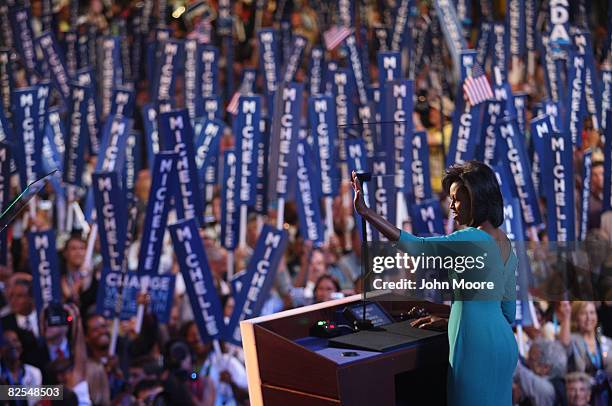 Michelle Obama, wife of presumptive Democratic nominee U.S. Sen. Barack Obama , waves to the crowd during day one of the Democratic National...