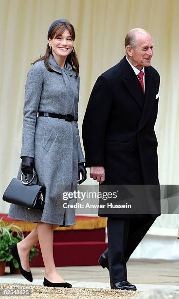 Carla Bruni-Sarkozy and Prince Philip, Duke of Edinburgh inspect the guards during a welcome ceremony at Windsor Castle on March 26, 2008 in Windsor,...