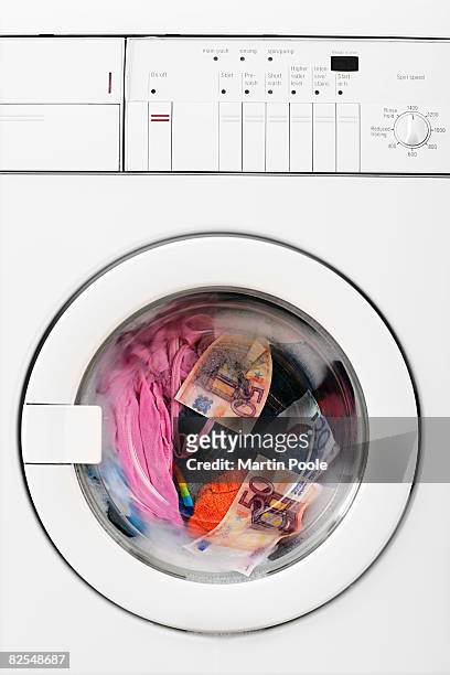 euros in washing machine fallen out of jeans - money laundery stock pictures, royalty-free photos & images