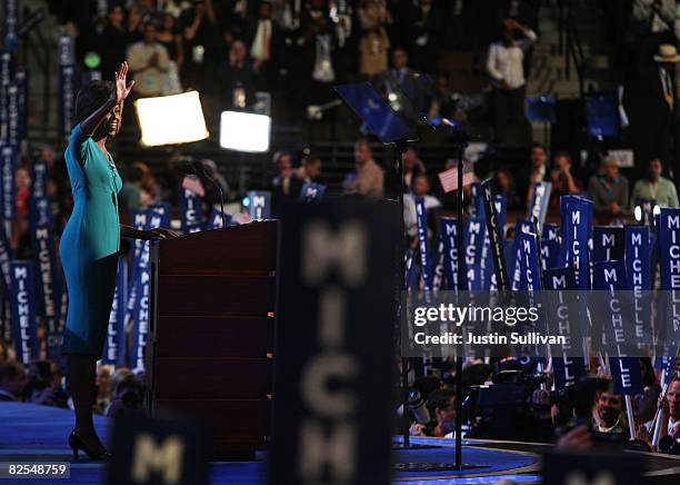 Michelle Obama, wife of presumptive Democratic nominee U.S. Sen. Barack Obama (D-IL waves during day one of the Democratic National Convention at the...
