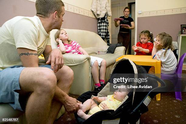 dinner time for young family at home - large family stock pictures, royalty-free photos & images