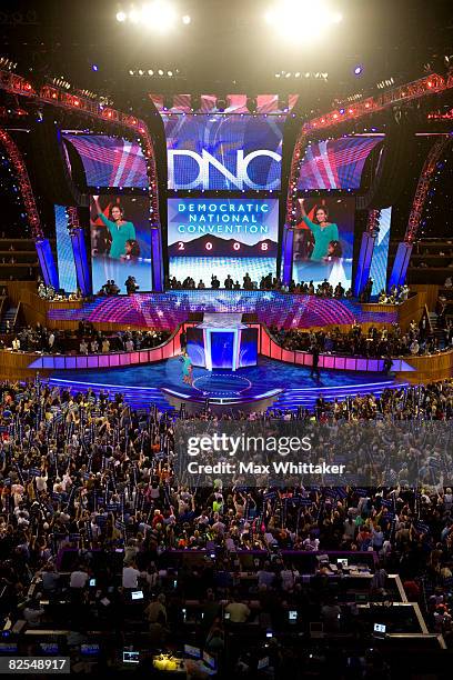 Michelle Obama, wife of presumptive Democratic nominee U.S. Sen. Barack Obama waves to the crowd during day one of the Democratic National Convention...