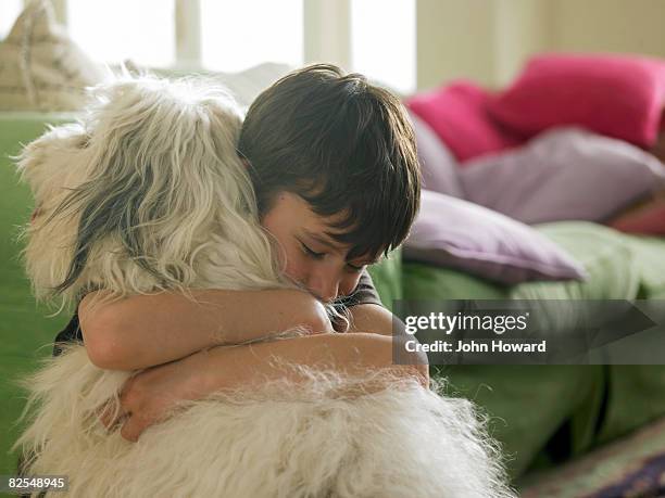 boy hugging his dog - hund bildbanksfoton och bilder
