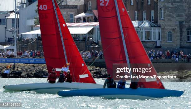 Sectators watch teams compete in preliminary heats during Aberdeen Asset Management Cowes Week on August 1, 2017 in Cowes, England.