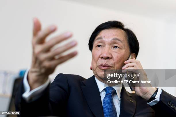 International Boxing Association president Wu Ching-Kuo gestures during a phone call at their headquarters at the the International House of Sport...