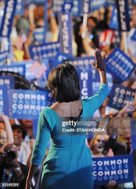 Michelle Obama, wife of Democratic Presidential candidate Barack Obama, waves to supporters at the Democratic National Convention 2008 at the Pepsi...