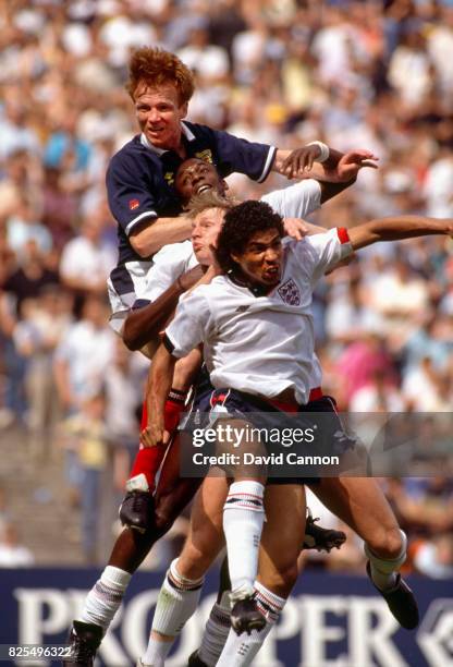 Scotland defender Alex McLeish outjumps England players John Fashanu; Stuart Pearce and Des Walker during the 1989 Rous Cup International at Hampden...