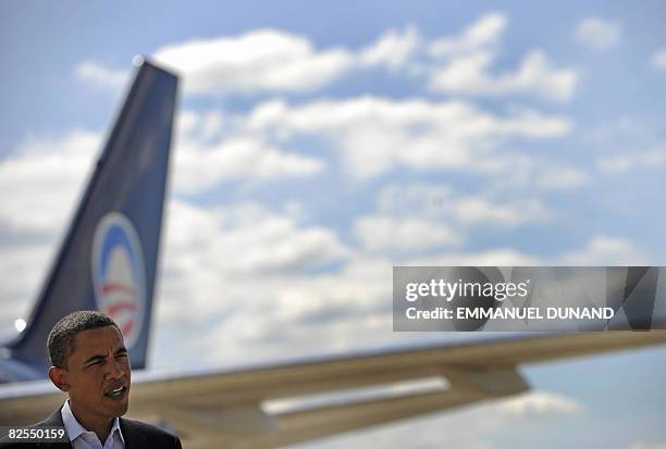 Democratic presidential candidate US Senator Barack Obama talks to the travelling media at Quad City airport in Moline, Illinois, on August 25, 2008....