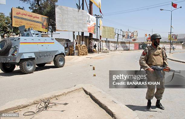 Pakistani paramilitary soldier stands guard on a street in Quetta on August 26, 2008 on the second anniversary of the killing of tribal chieftain...