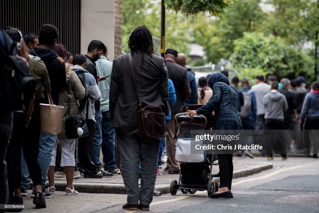 Queue In House Immigrants queue around the government Home Office building of Becket ...