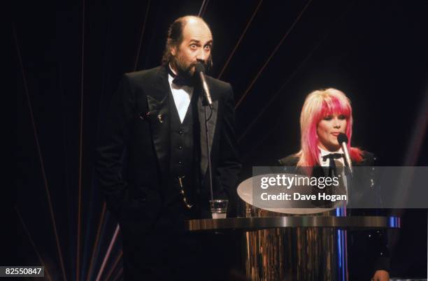 Hosts Mick Fleetwood and Samantha Fox at the BRIT Awards ceremony at the Royal Albert Hall, London, 18th February 1989.