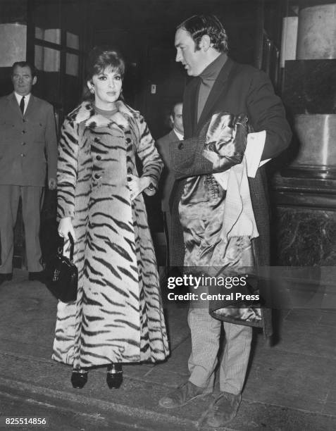 Italian actress Gina Lollobrigida leaves the Savoy Hotel in London for Elstree Studios, 3rd January 1970. She is wearing a tigerskin fur coat,...