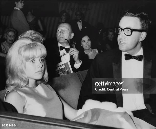 American actress Sue Lyon with co-star Peter Sellers at the premiere of the film 'Lolita' at the Columbia Theatre in London, 6th September 1962.