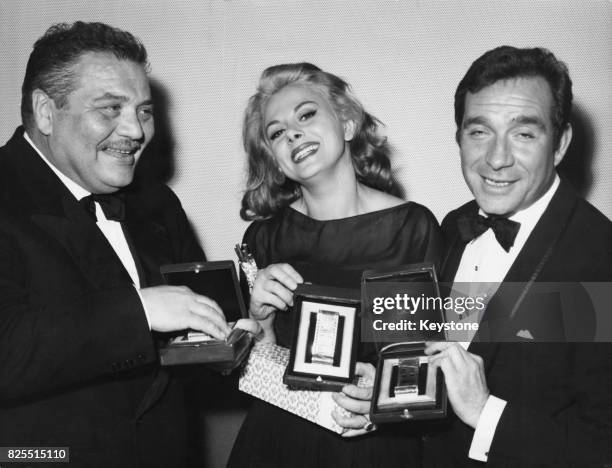 From left to right, actors Folco Lulli, Sandra Milo and Ugo Tognazzi receive Nastri d'Argento at the Italian National Syndicate of Film Journalists...