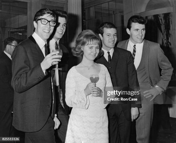 Scottish singer Lulu with The Shadows, Cliff Richard's backing band, at the Variety Club of Great Britain's opening luncheon of the season, and...