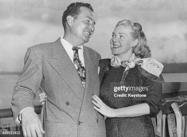 American musician and singer Phil Harris and his wife, actress Alice Faye, arrive home in New York on the liner 'SS Queen Elizabeth' after a trip to...