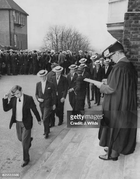 Dr Robert James , headmaster of Harrow School, performs the 'Talking the Bill' ceremony on Founder's Day, UK, 16th March 1963.