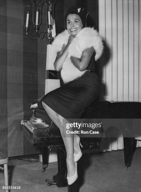 American singer and actress Lena Horne during a reception at the Savoy Hotel in London, where she is performing a four-week season of her cabaret...