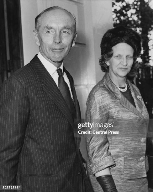 The new British Prime Minister Alec Douglas-Home leaves his home in Carlton Gardens, London, with his wife Elizabeth, for his meeting with the Queen...