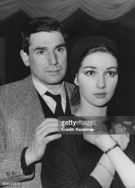 French actor and director Robert Hossein with actress Yori Bertin, who is starring with him in the play 'Les Six Hommes En Question' at the Theatre...
