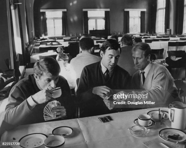 From left to right, England footballers Roger Hunt , Gordon Banks and Bobby Charlton enjoy a game of cards after a talk by the team manager at...