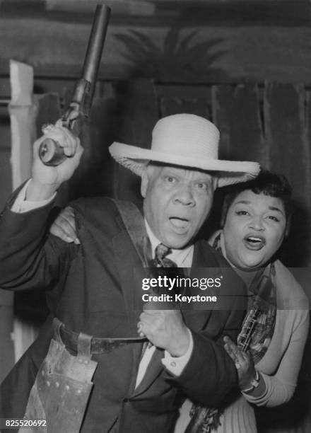 American jazz musician Sidney Bechet with singer Mattye, the oldest of the Peters Sisters, while rehearsing for the new operetta 'New Orleans' in...