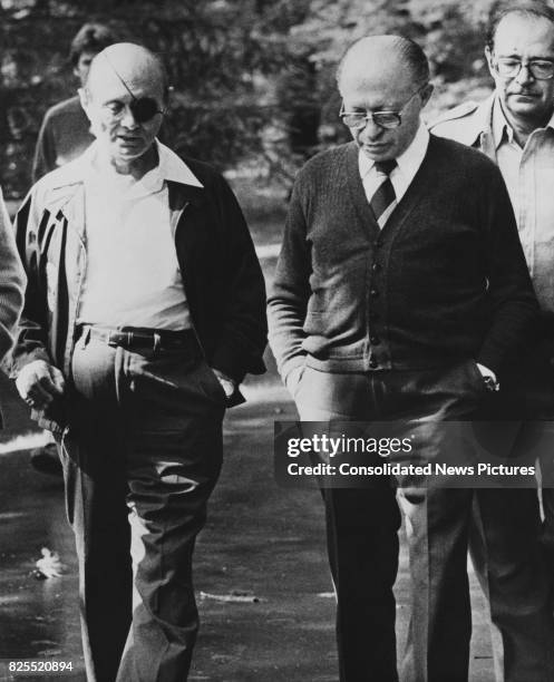 Israeli Prime Minister Menachem Begin with Israeli Foreign Minister Moshe Dayan at the end of the Camp David summit meetings near Thurmont, Maryland,...