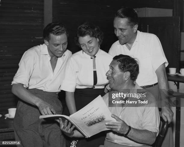 Composer Arthur Benjamin goes over the score for his opera 'A Tale of Two Cities' with singers Emlyn Ellis , Heather Harper and John Cameron , 10th...