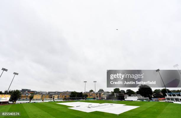 The covers come on as heavy rain stops play during the Tour Match between Essex and West Indies at Cloudfm County Ground on August 2, 2017 in...