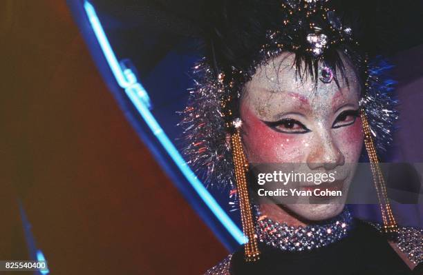 Thai transsexual poses for the camera before going on-stage for a beauty contest a club in Bangkok. Transsexuals, or Katoeys as the Thais call them,...