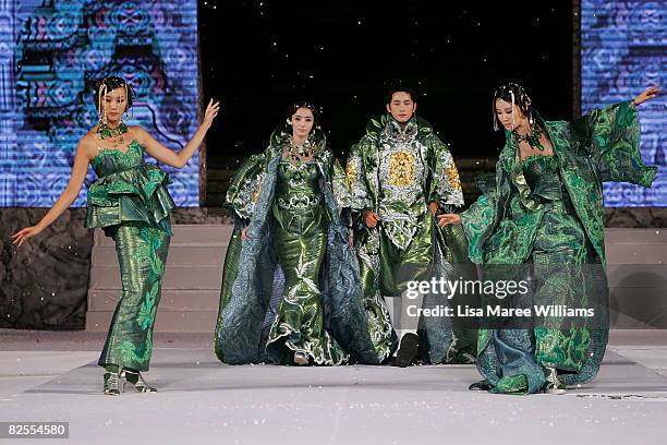 Models and celebrities Chae -Young and Park Si-Hoo showcase designs by Korean couture designer Andre Kim at the opening catwalk show on the first day...