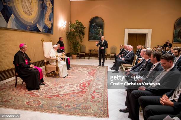 Pope Francis talks to President Rolf Koenigs during a private audience with his team of Borussia Moenchengladbach in the Palace of the Vatican on...