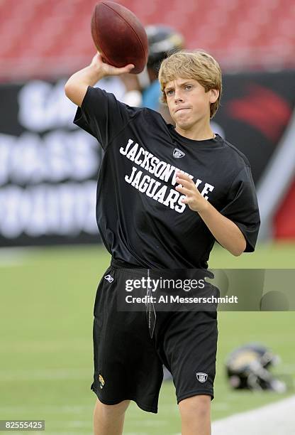 Luke Del Rio, son of coach Jack Del Rio of the Jacksonville Jaguars, tosses a football before play against the Tampa Bay Buccaneers at Raymond James...