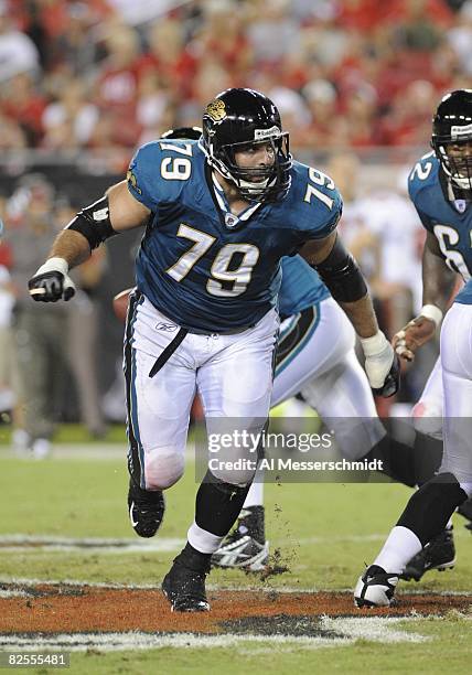 Offensive tackle Tony Pashos of the Jacksonville Jaguars blocks against the Tampa Bay Buccaneers at Raymond James Stadium on August 23, 2008 in...