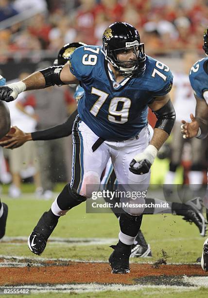 Offensive tackle Tony Pashos of the Jacksonville Jaguars blocks against the Tampa Bay Buccaneers at Raymond James Stadium on August 23, 2008 in...