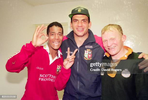 Lions players Jeremy Guscott Martin Johnson and Neil Jenkins celebrate in the dressing room after victory in the 2nd Test match between South Africa...