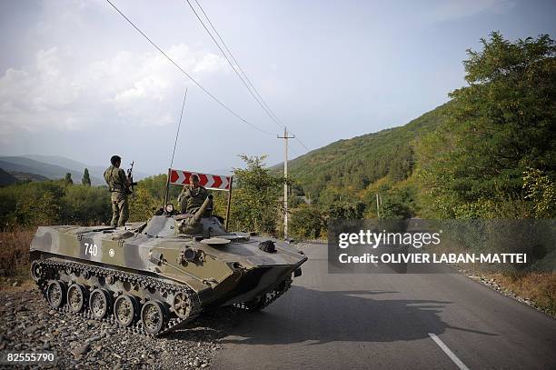 Russian tank keeps a new position on the historical border of South Ossetia, near Akhalgori, on August 26, 2008. Russian President Dmitry Medvedev...