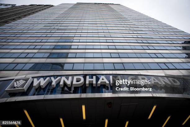 Signage is displayed on the exterior of a Wyndham Grand Chicago Riverfront Hotel in downtown Chicago, Illinois, U.S., on Thursday, July 27, 2017....