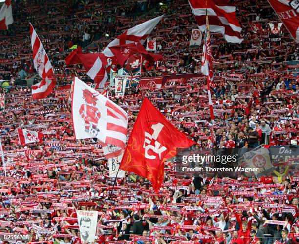 Fans of Kaiserslautern celebrate after winning the match during the Second Bundesliga match between 1.FC Kaiserslautern and 1.FC Nuernberg at the...