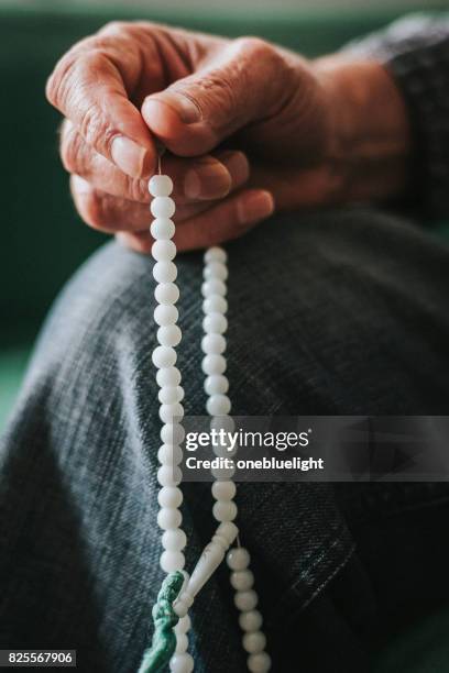 rosary beads - onebluelight stock pictures, royalty-free photos & images