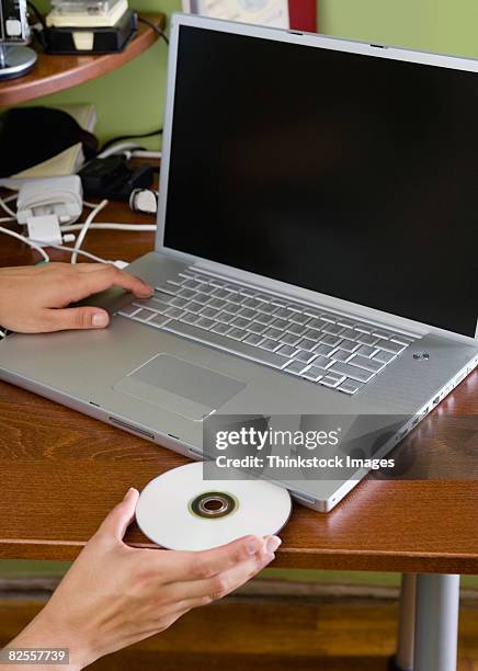 Insert Cd Computer 111 Inserting Cd Stock Photos, High-Res Pictures, and Images - Getty Images