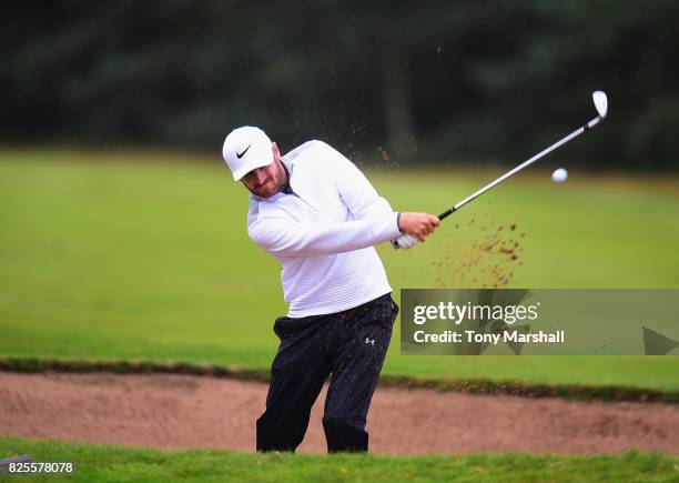 James Ward of Dewsbury District Golf Club plays out of a bunker on to the 18th green during Day One of the Galvin Green PGA Assistants' Championship...