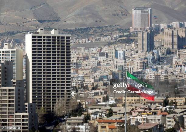 tehran urban skyline and iran flag - iranian flag stock pictures, royalty-free photos & images
