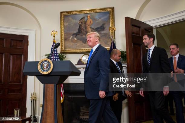 President Donald Trump arrives before making an announcement on the introduction of the Reforming American Immigration for a Strong Economy Act with...