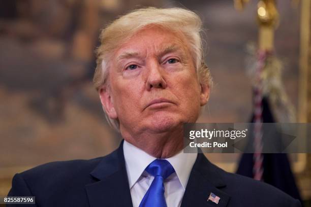 President Donald Trump attends the announcement of the introduction of the Reforming American Immigration for a Strong Economy Act in the Roosevelt...
