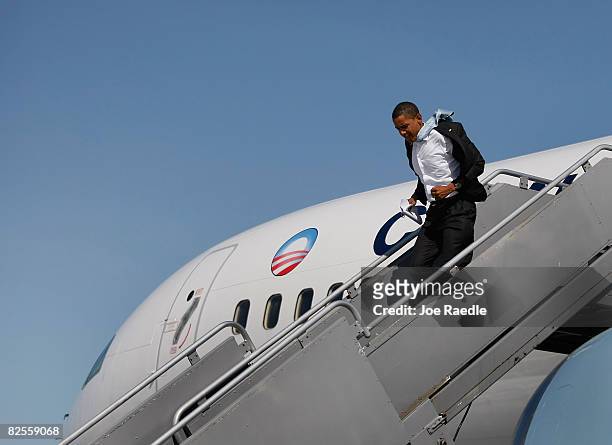 Presumptive Democratic presidential candidate U.S. Sen. Barack Obama walks off his campaign plane as he arrives at the airport in August 26, 2008 in...