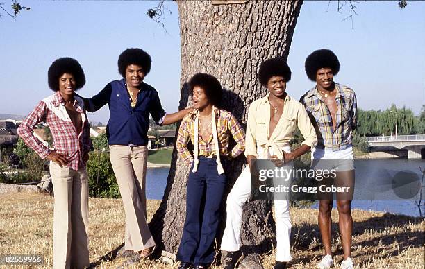 Michael Jackson, Tito Jackson, Marlon Jackson, Randy Jackson and Jackie Jackson of The Jacksons pose during a publicity photo shoot after the band...
