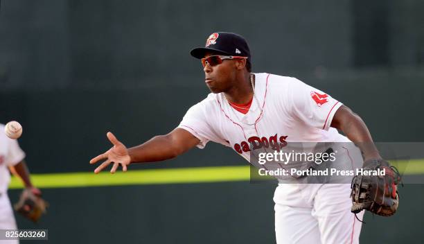 Portland's Josh Ockimey tosses out a Richmond Flying Squirrel at first base Tuesday, August 1, 2017.
